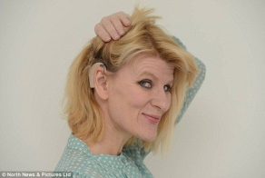 A deaf woman is overcome by emotion as she HEARS for the first time