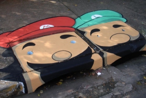 Two Artists Cover Gray Streets With Colorful Character Illustrations