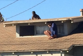 Woman Hides On Her Roof While Intruder Searches For Her