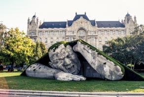 A Giant Sculpture Crawls Out Of The Ground In Budapest