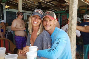Couple Asks Internet To Photoshop Out Shirtless Guy From Engagement Photo, Regrets It Immediately