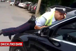 Беременная женщина на машине депутата ЕР сбила полицейского (фото+видео)