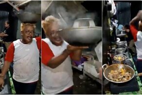 Малайзийский повар весело швыряется кастрюлями и кладет руку на огонь