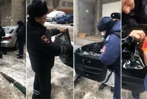 Инспектора ГИБДД приклеил обратно оторванную водителем тонировку и сделал замеры