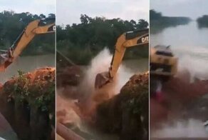 Рабочий снял зрелищное падение экскаватора в реку