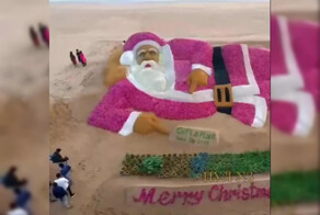 В Индии художник создал самого большого в мире Санта-Клауса из лука и песка