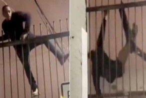 Неудачливый воришка завис над землёй, зацепившись штанами за забор