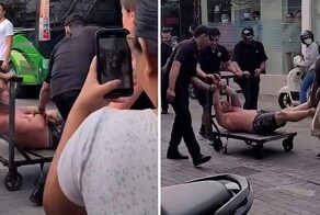 Охранники бара связали туриста и вывезли его на тележке
