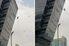 В Катаре мойщик окон, выполняя свою работу на высоте, начал испытывать скуку и решил развлечься необычным способом