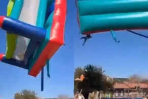 Надувной замок с детьми взлетел на 12 метров
