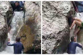 Мужчины спасли мальчика, застрявшего между огромными валунами в бурной реке