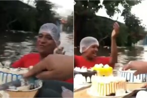 В Колумбии жители устроили праздник по грудь в воде, используя надувной матрас вместо стола