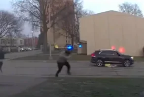 Камера у дома сняла стрельбу в Кливленде — женщине невероятно повезло