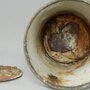 В кружке из музея Освенцима нашли клад