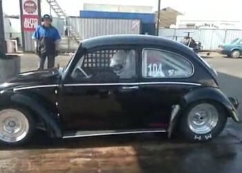 VW Beetle Black Current vs Tesla Roadster