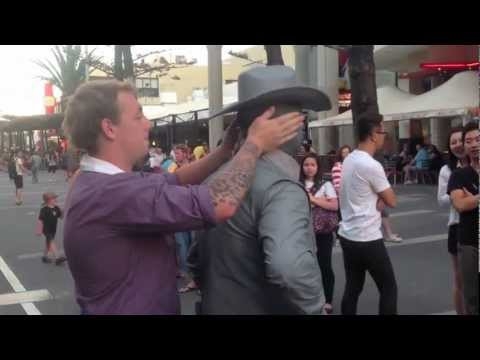 Guy Gets Punched by Street Performer (video)