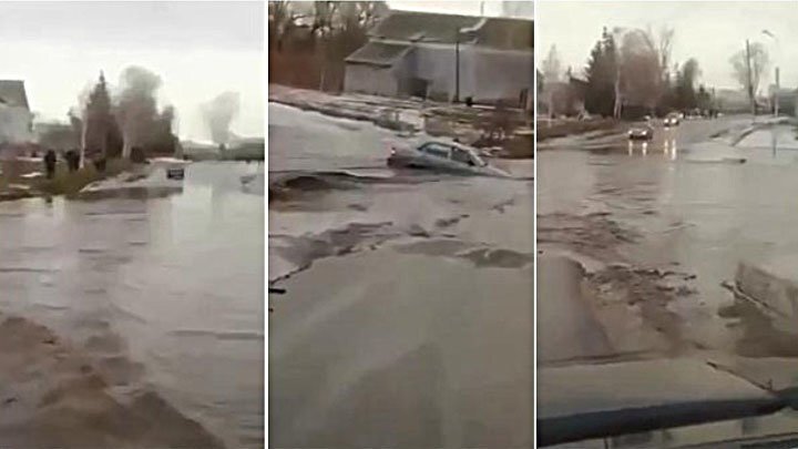 Отчаянный водитель: бурный поток воды смыл автомобиль с дороги в Казахтане