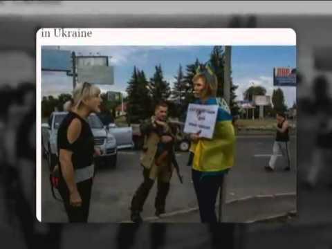 Террористы избили и унизили женщину, завернутую во флаг Украины 