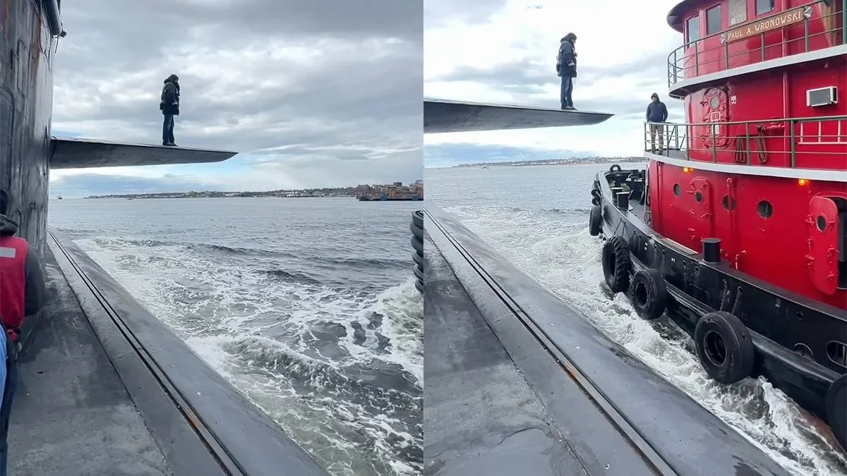 Мужчина шагает с подводной лодки на другой корабль в открытом море