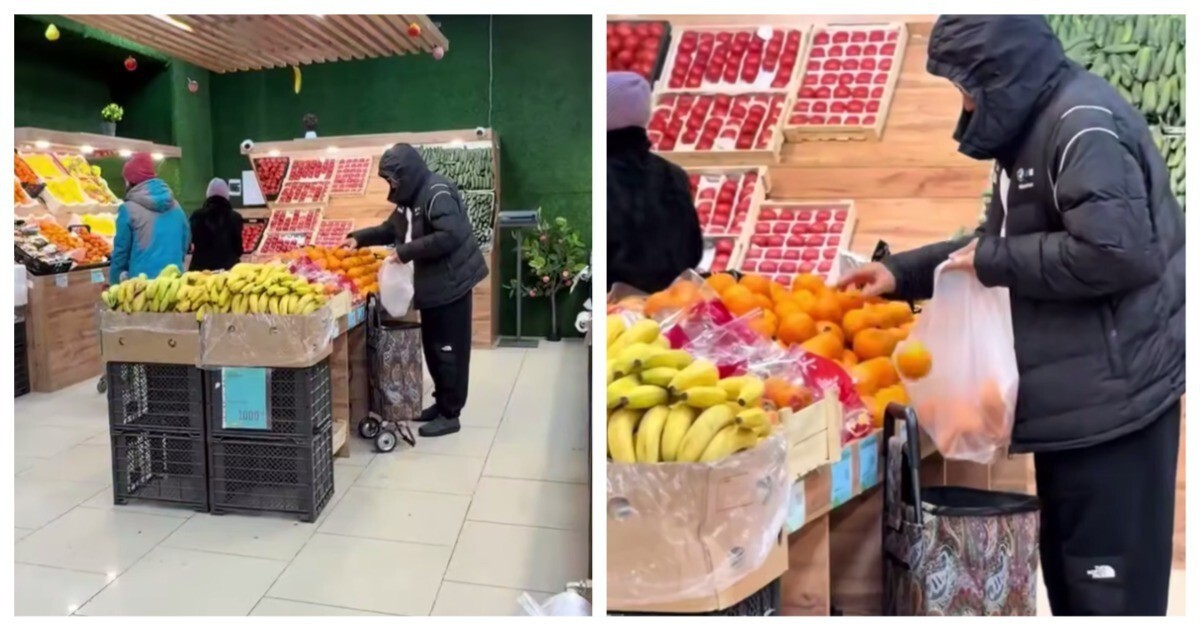 Мужчина крадёт апельсины в магазине