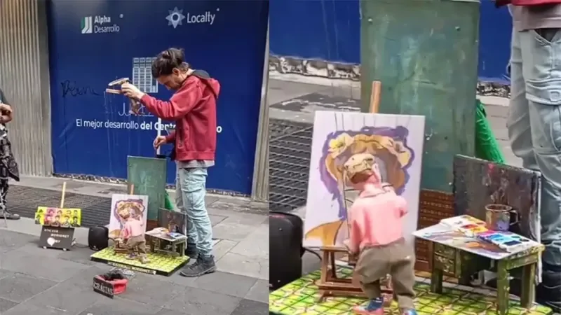 Художник рисует картины с помощью марионетки