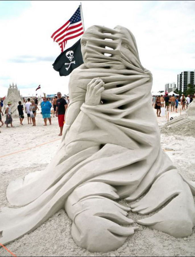 Sand Sculpture Man Falling Apart  