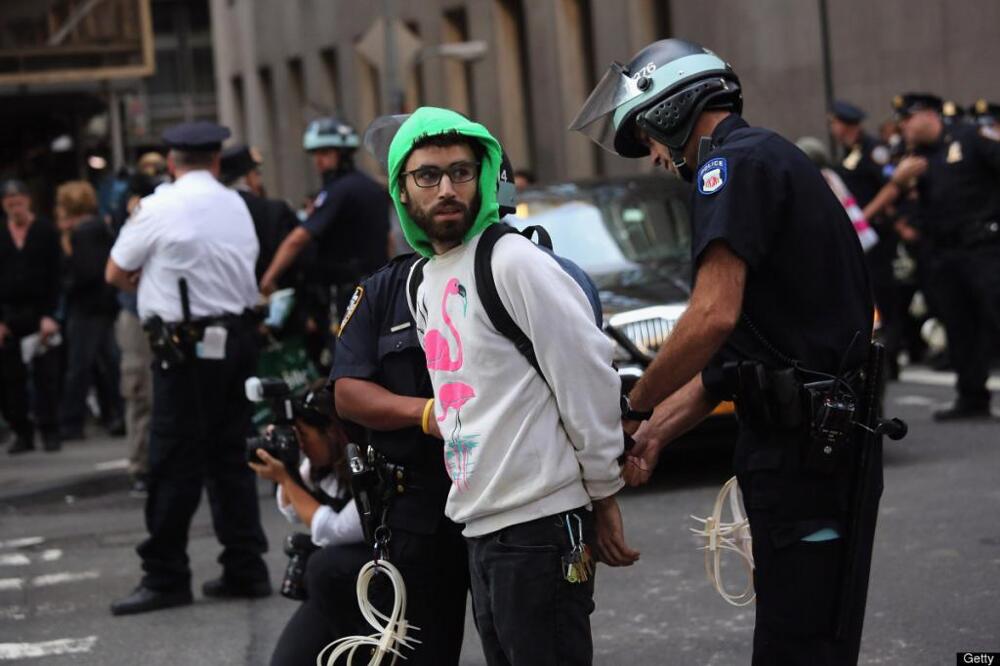 Police man arrests Peaceful Protester 
