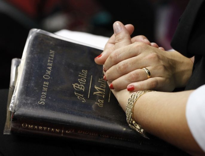 Holding Hands on the bible 