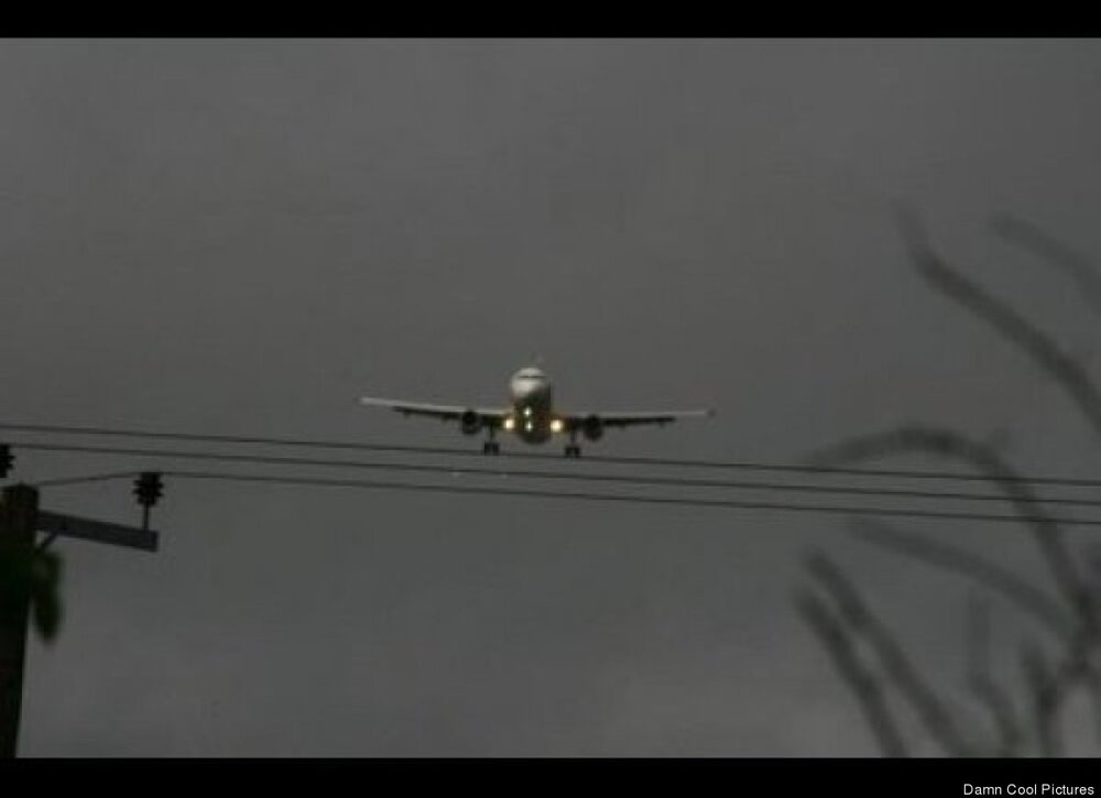 Plane Above telephone wires 