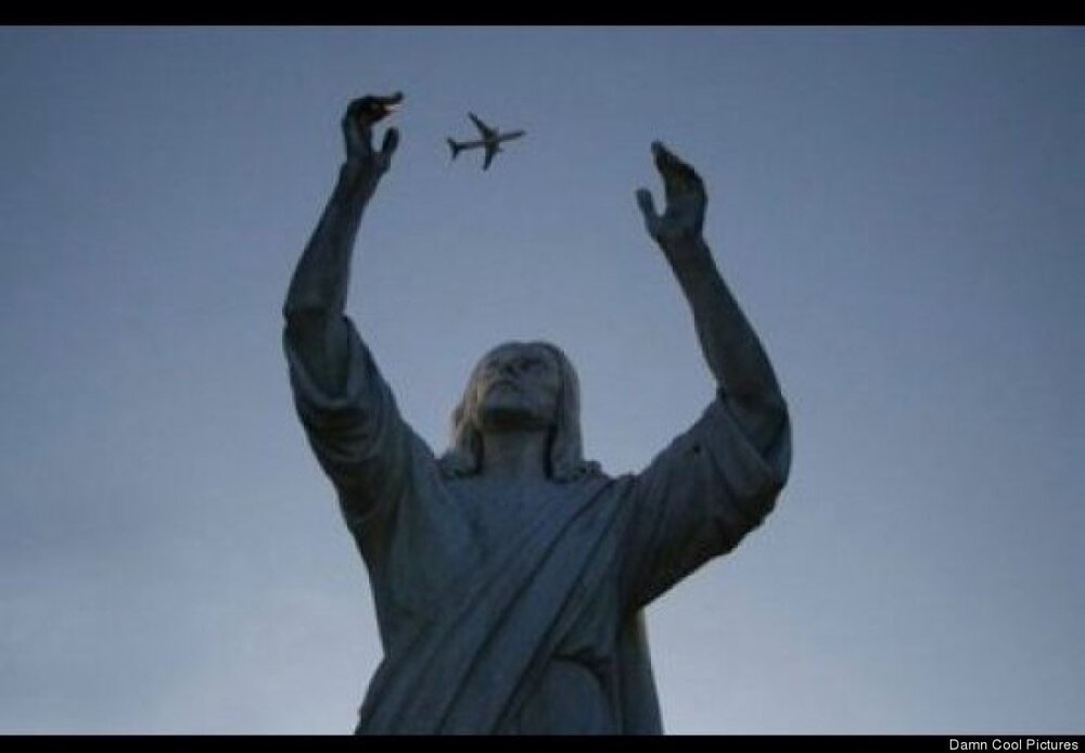 statue reaches for plane 