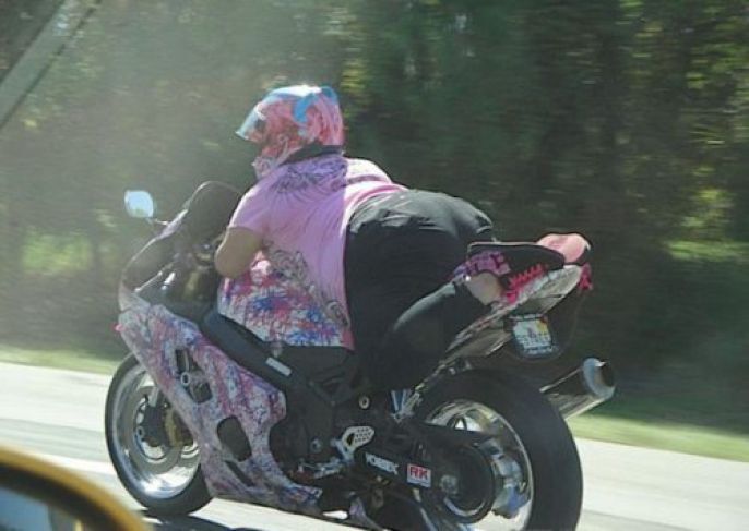 laying down on motorcycle 