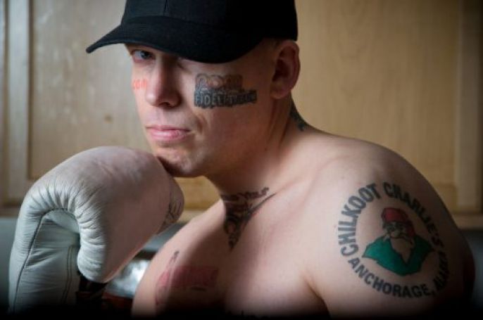 Tattoos and boxing glove 