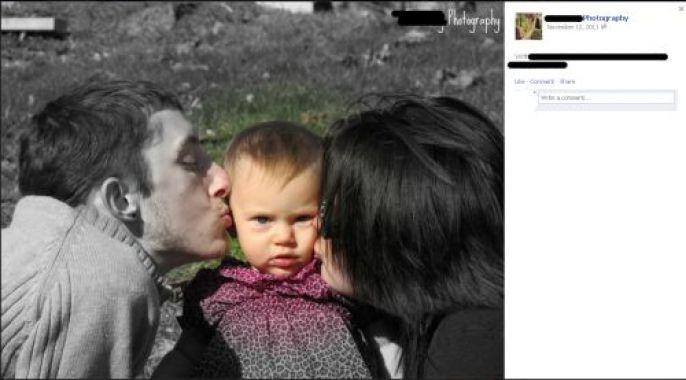 couple kissing the child 