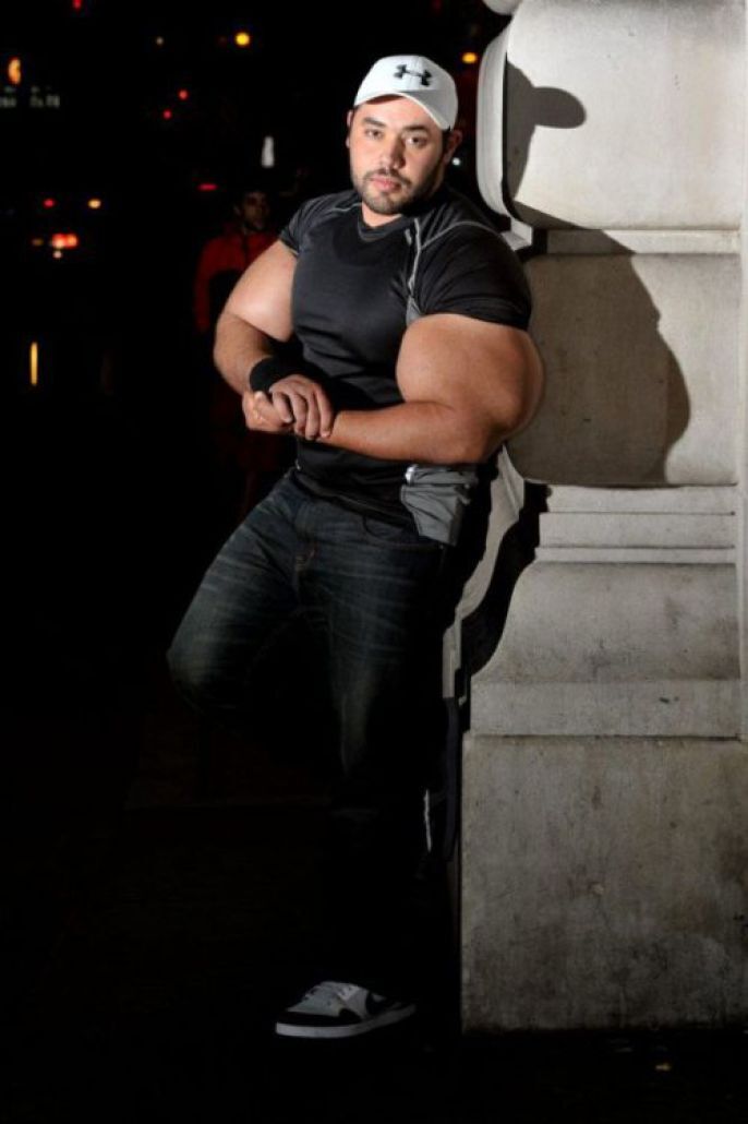 Posing with his huge muscles 