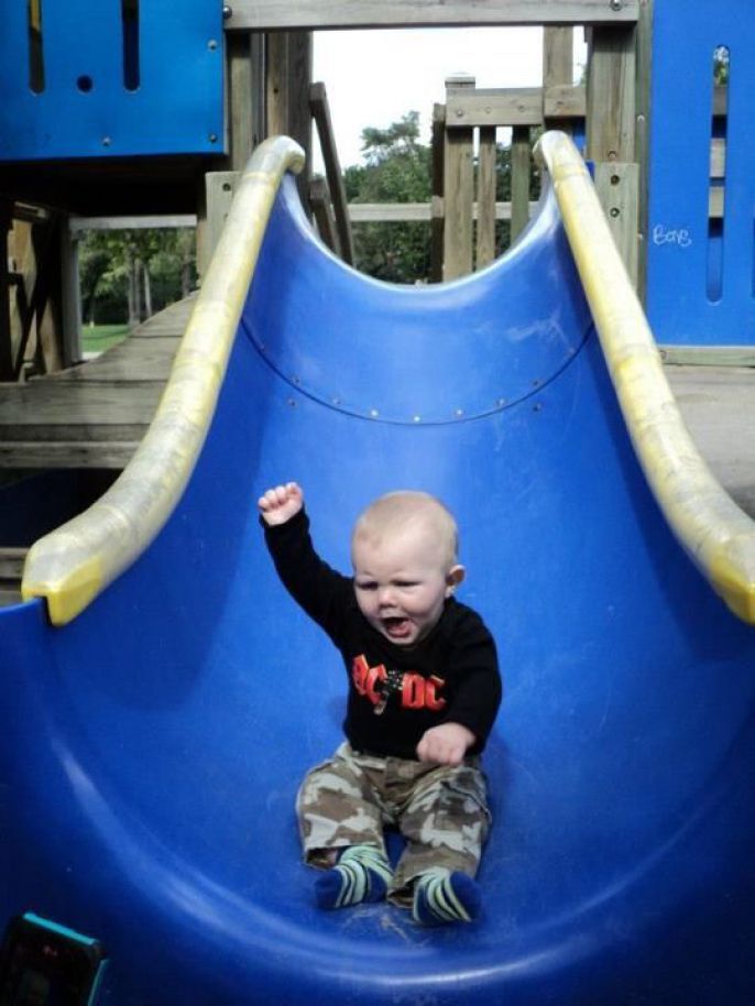 baby rocking the slide 