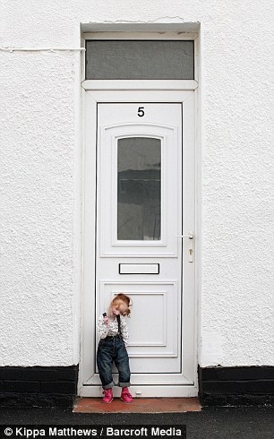 Worlds Smallest Girl Next To Front Door 