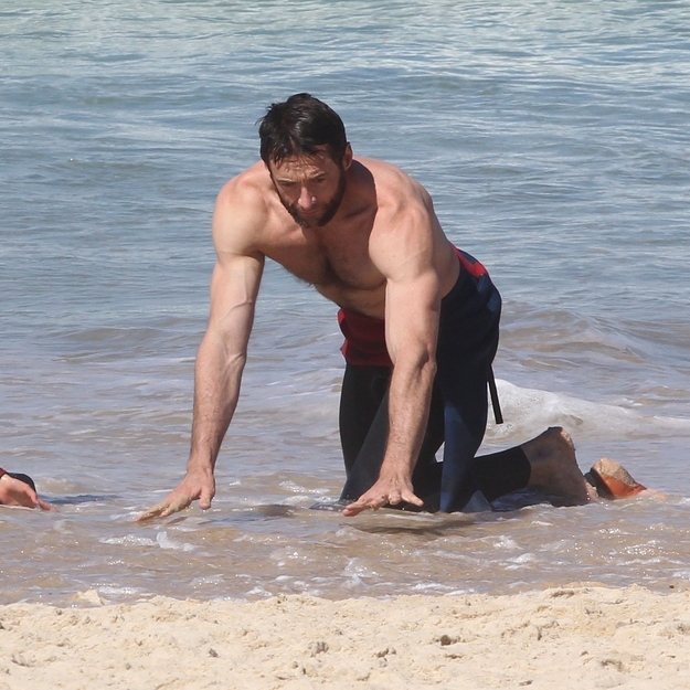 Hugh Jackman Sits in the waves 