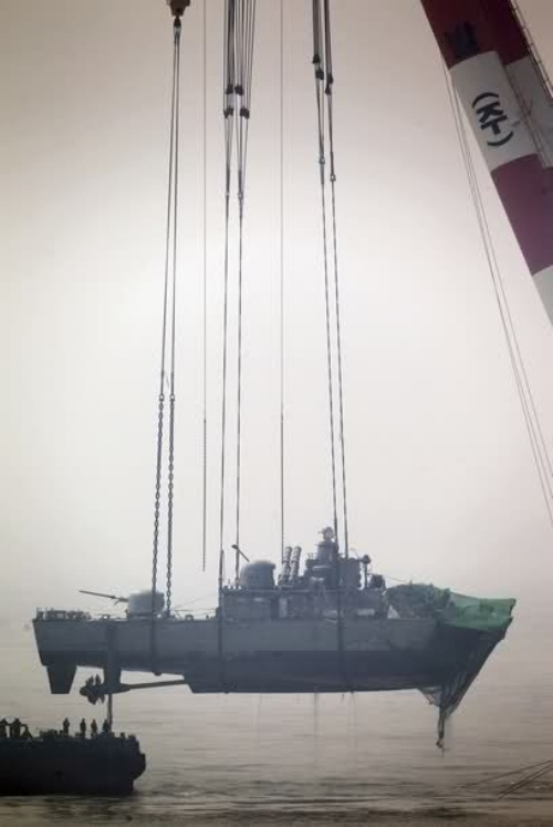 Crane Lifts Navy Ship 