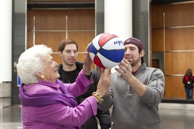 Barbara Bush with a basketball spinning on her finger