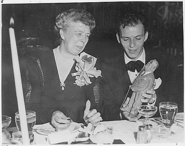 Eleanor Roosevelt with an figurine of FDR held by Frank Sinatra