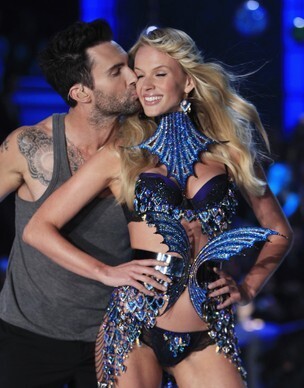 Adam Levine Stealing a Kiss from one of the angels. 