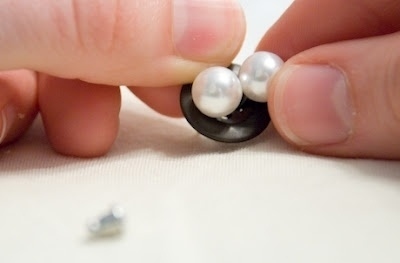 Use a button to keep earrings together