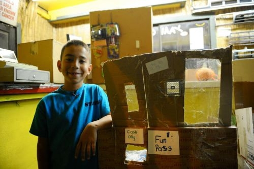 Kid builds an elaborate arcade out of cardboard boxes 