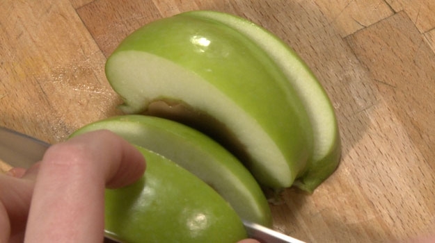 To serve, place apples jello-down on cutting board. Slice in half, then in half again.