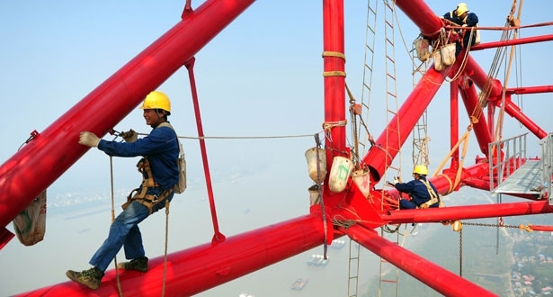 Workers on top of world's tallest pylon 