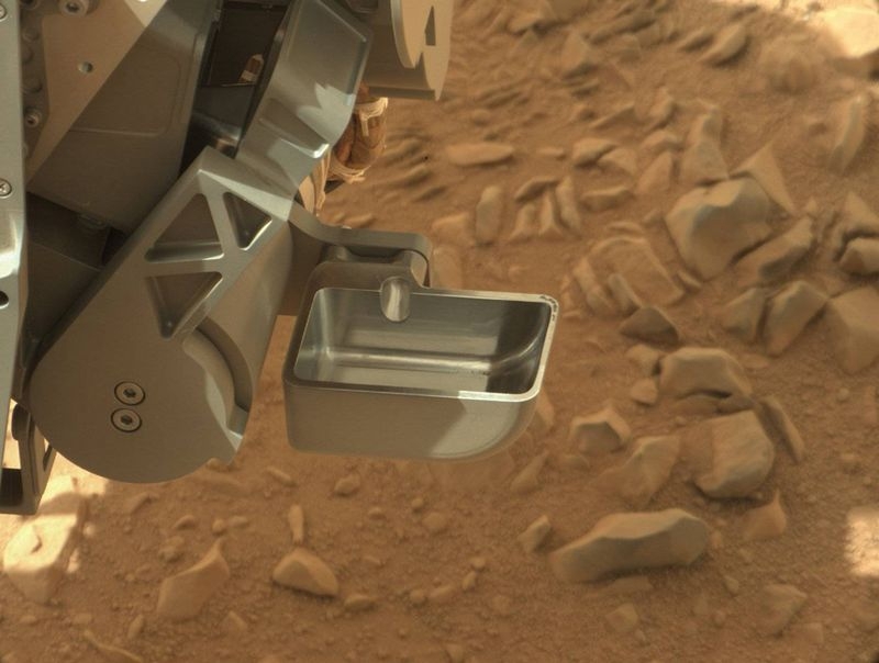 Curiosity Stars Taking Samples of Soil