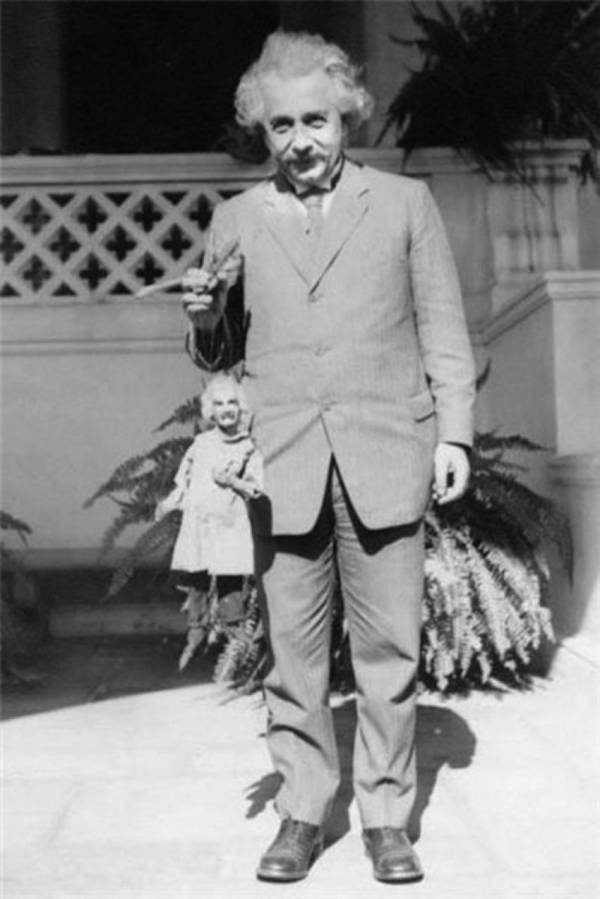 Albert Einstein holding a puppet Albert Einstein. Photo by Harry Burnett, c. 1931