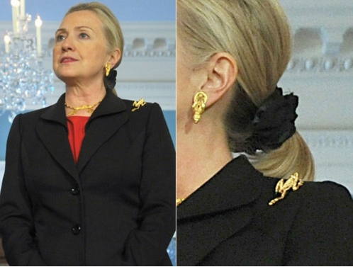 She wears frog jewelry... ON HER SHOULDER.