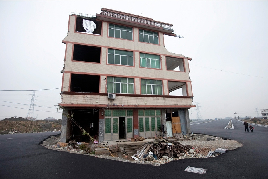 Homeowners don't give up. China builds highway anyways. 