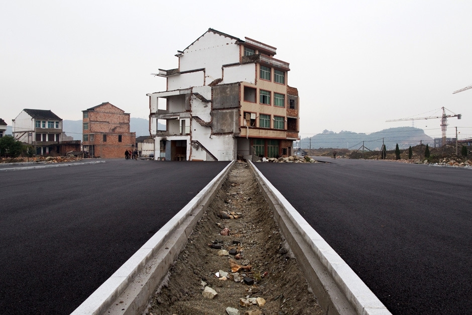 Homeowners don't give up. China builds highway anyways. 